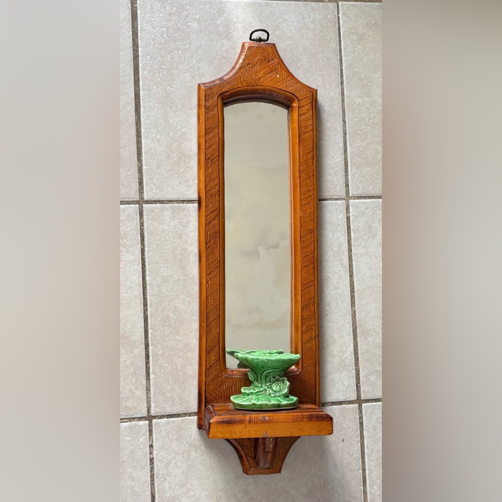 vintage wooden mirror sconce with a green ceramic candle holder